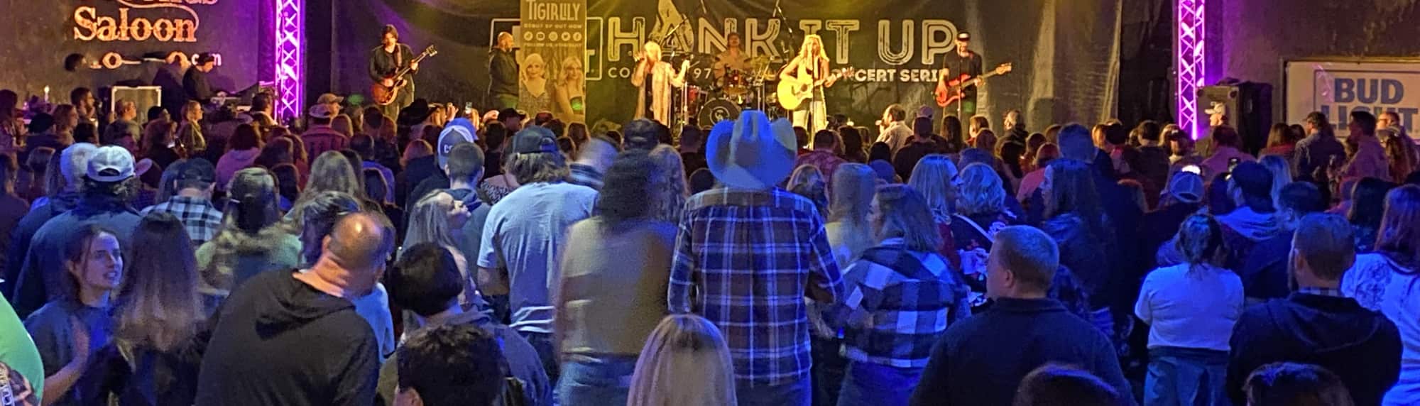 country concert with fans wearing cowboy hats Milwaukee