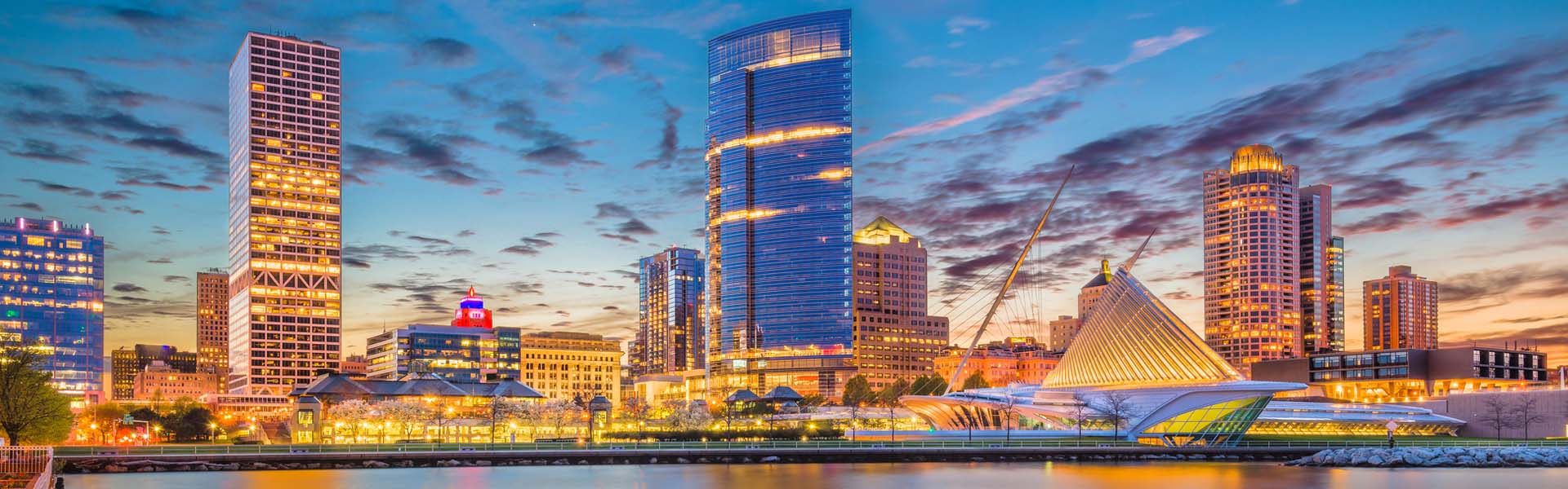Neon color image of a band playing and people singing along